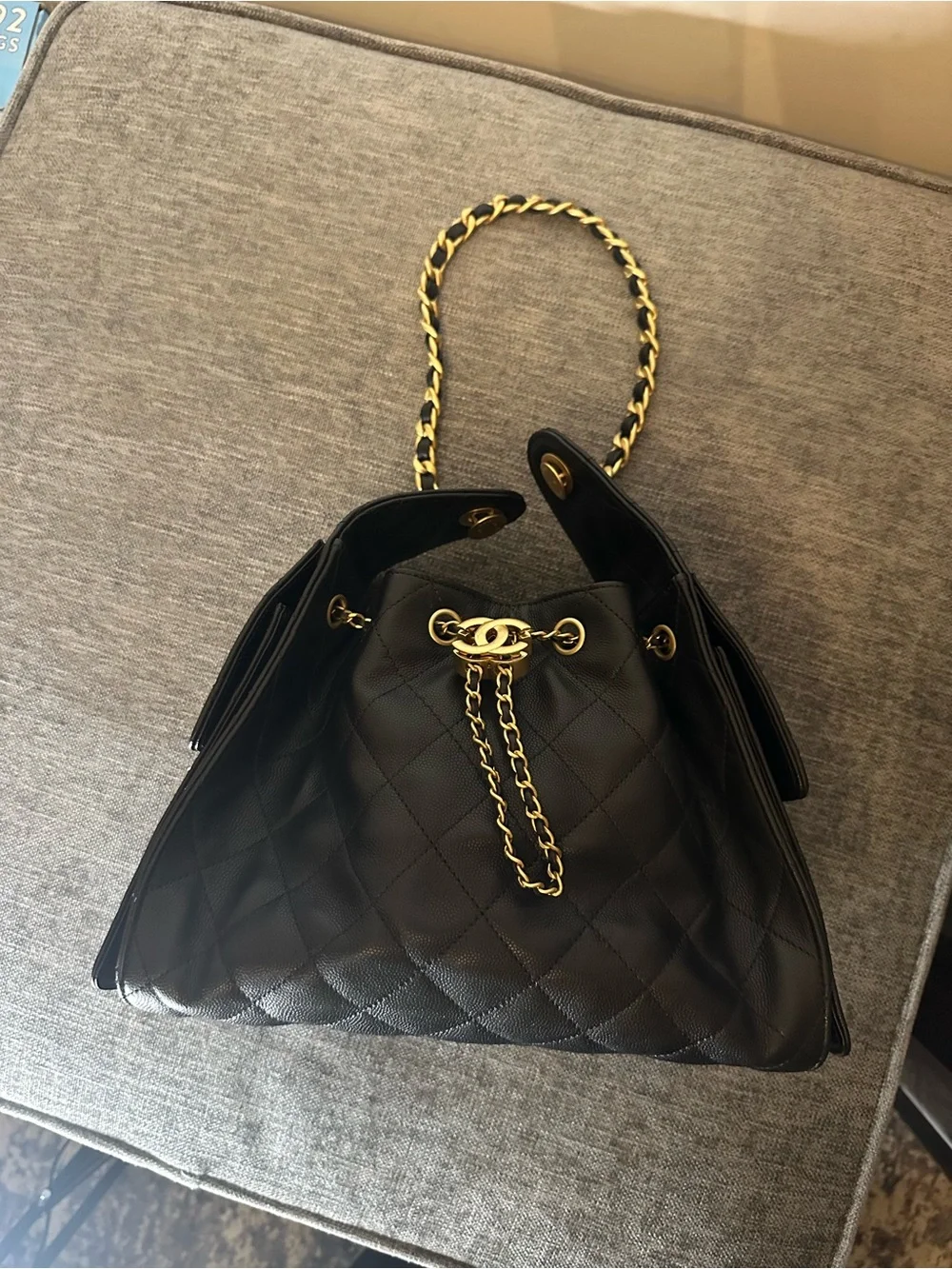 CHANEL 25  Small Black Quilted Drawstring Shoulder Bag with Gold CC Hardware